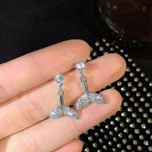 Authentic Celestial Fin Radiant Studs: A Talisman of Flow and Abundance