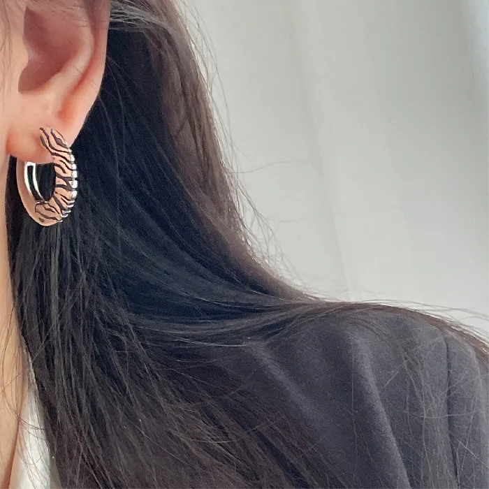 Authentic Primal Instinct: The Zebra-Striped Disc Hoops