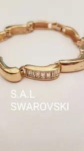Authentic S.A.L SWAROVSKI CLEAR BAGUETTE RHINESTONE WAVE GOLD PLATED BRACELET BANGLE VTG