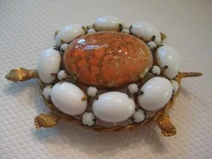 Authentic Turtle's Wisdom: Mottled Coral and White Glass Cabochons on Golden Armor