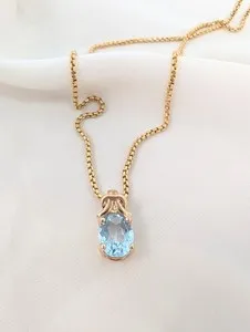Authentic The Eternal Embrace Golden Love Knot and Blue Topaz Pendant