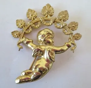 Authentic The Celestial Messenger: Vintage Miriam Haskell Cupid and Garland Gold-Plated Talisman