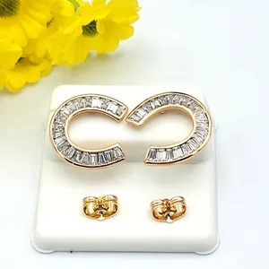 Authentic Radiant Fortune: 18K Gold Plated Icy Horseshoe Talisman Earrings
