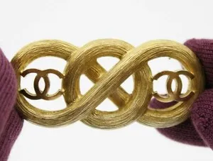 Authentic The Infinite Radiance of the Gilded Monogram Brooch