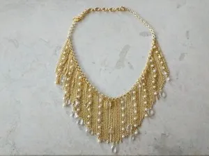 Authentic The Celestial Cascading Pearl Bib: A Radiance of Golden Grace