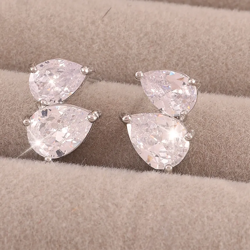 Authentic Celestial Raindrop Studs: A Symphony of Shimmering Light