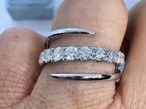 Authentic The Golden Spiral Eternity Ring of Radiant Moissanite
