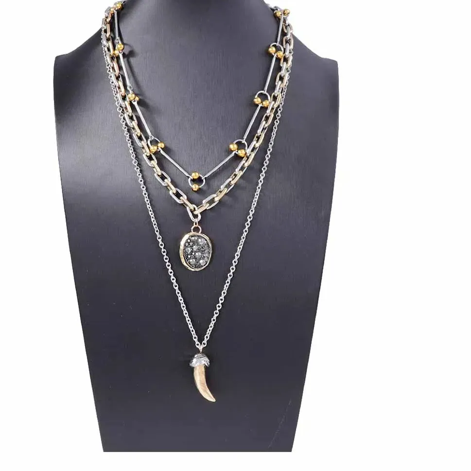 Authentic Sacred Menagerie: Three-Faced Animal Horn Pendant