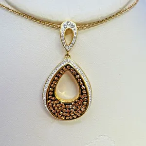 Authentic Radiant Luminescence: The 18k Gold Plated Clear and Chocolate Crystal Talisman Suite