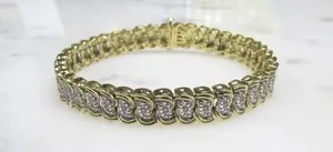 Authentic Celestial Harmony: 0.10ctw Diamond Gold Plated Sterling Silver Tennis Bracelet
