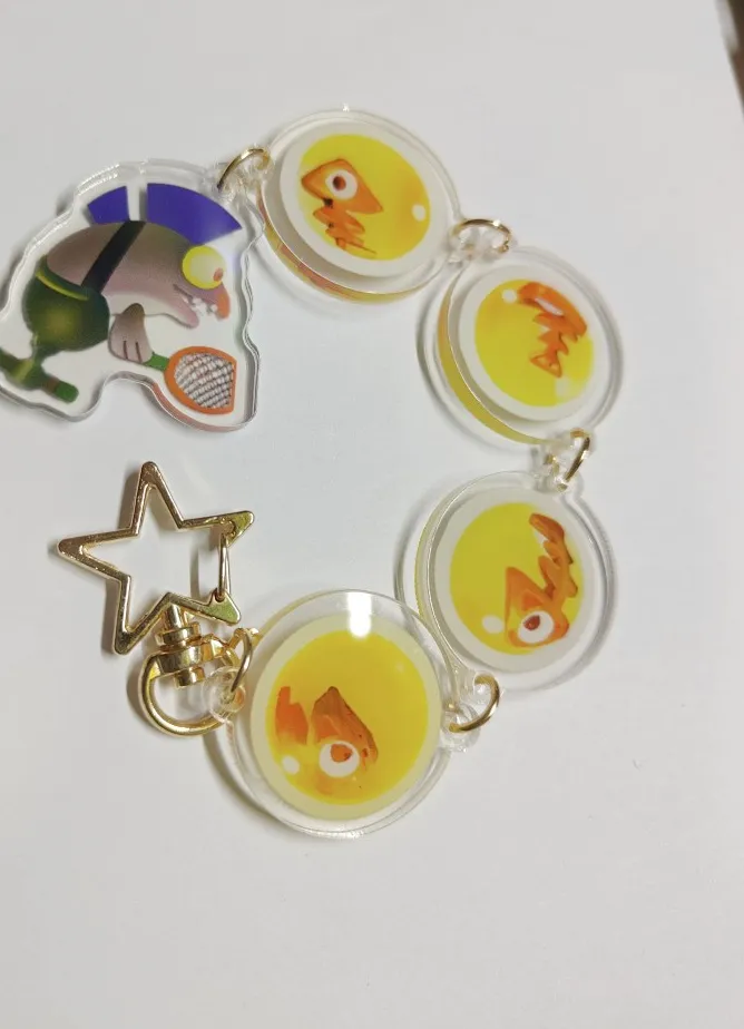 Authentic Golden Splatoon 3 Keychain - A Splash of Mythic Power