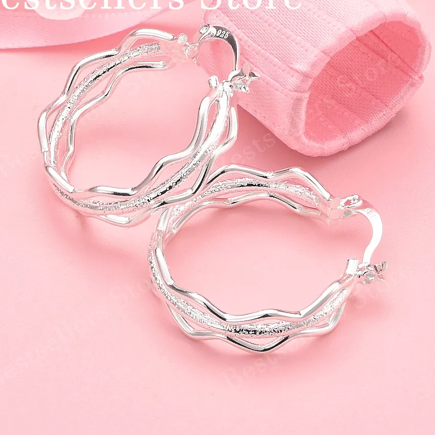Authentic Tides of Tranquility: Triple Layer Wave Earrings for Serene Protection