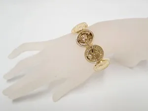 Authentic Mademoiselle's Radiant Protection: Chanel's Vintage Gold Plated CC Logo Bangle