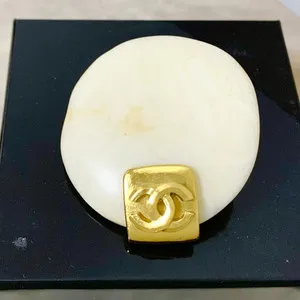 Authentic Guardian of Elegance: Chanel's CC Logo Brooch Shines with Ancient Protection