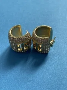 Authentic Whispers of Elegance: Golden Charm Drop Earrings for the Modern Goddess