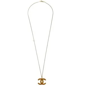 Authentic Golden Elegance: C.C. Chanel's Timeless Symbol of Inner Wisdom