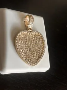 Authentic Radiant Luminescence: The Golden Moissanite Talisman