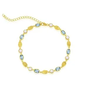 Authentic Celestial Harmony: Mother of Pearl and Sky Blue Topaz Golden Bracelet