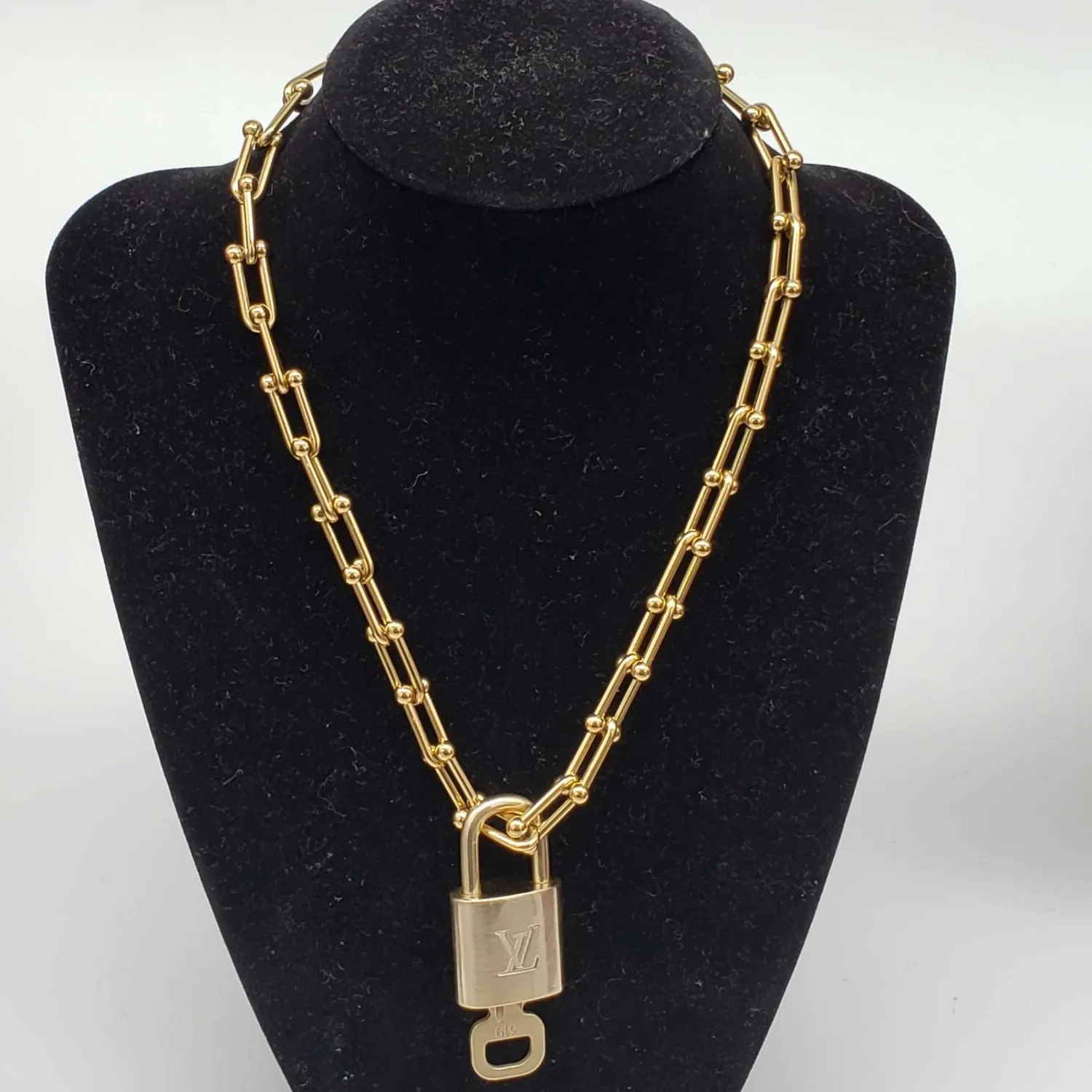 Authentic The Gilded Guardian: Louis Vuitton Lock & Key Chain