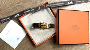 Authentic Leopard's Whisper: Hermes Gold‑Plated Enamel Clic H Bracelet