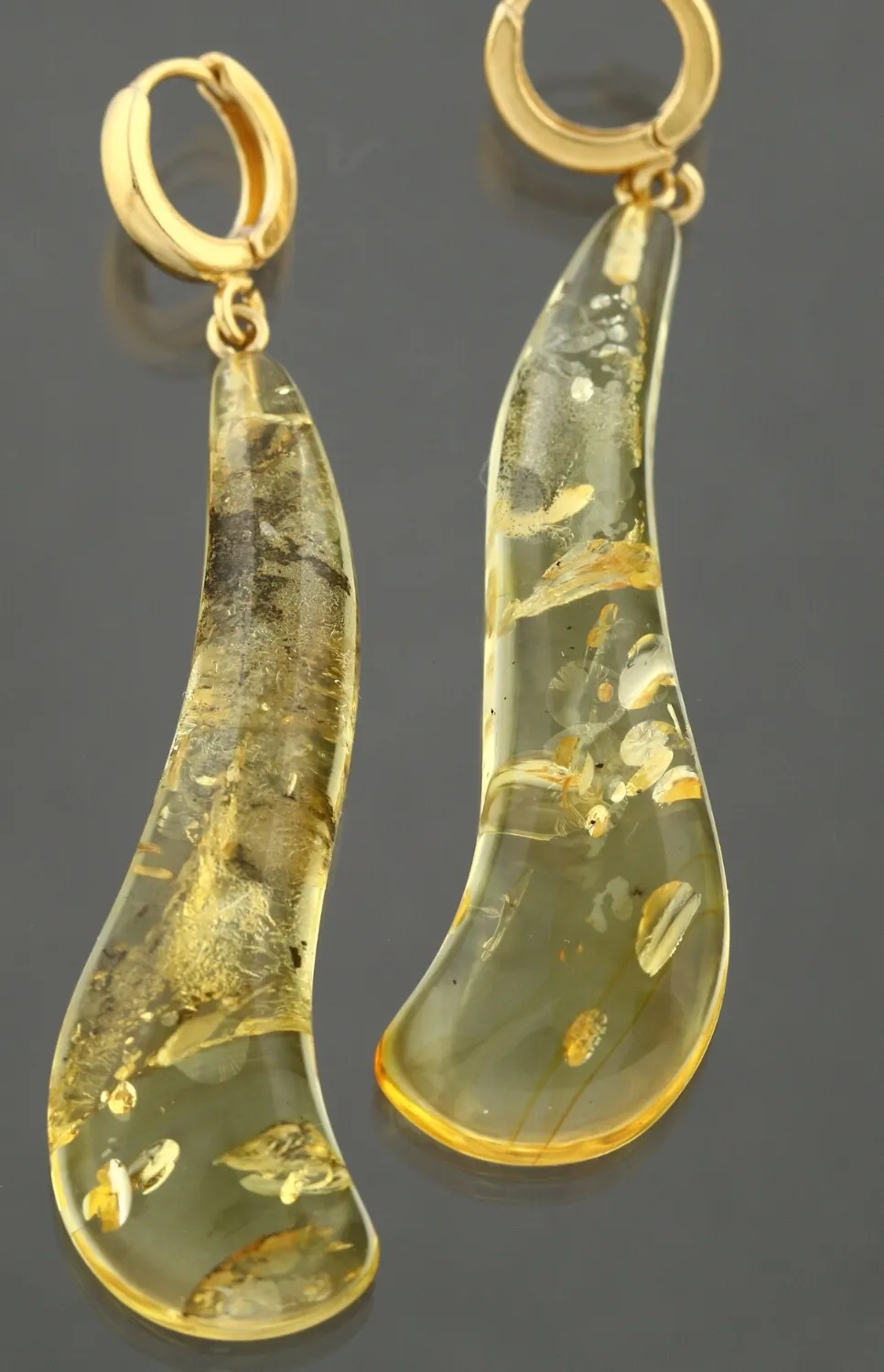 Authentic Solar Radiance: Baltic Amber and Gilded Silver Talismans