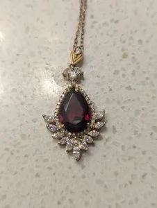 Authentic Crimson Dawn Halo Pendant: 2.3 Ct Pear Garnet, Gold-Plated Radiance