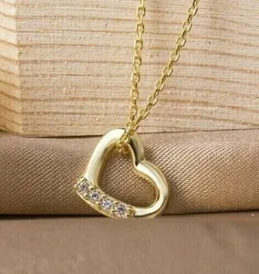 Authentic The Golden Heart of Radiance: 14k Yellow Gold Plated Heart and Diamond Simulant Pendant