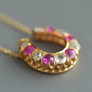 Authentic Radiant Fortune: The Pink Ruby Horseshoe Amulet in 14K Gold Plate