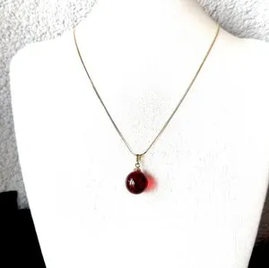 Authentic Celestial Ember: Natural Baltic Cherry Amber and Gold-Plated Silver Talisman